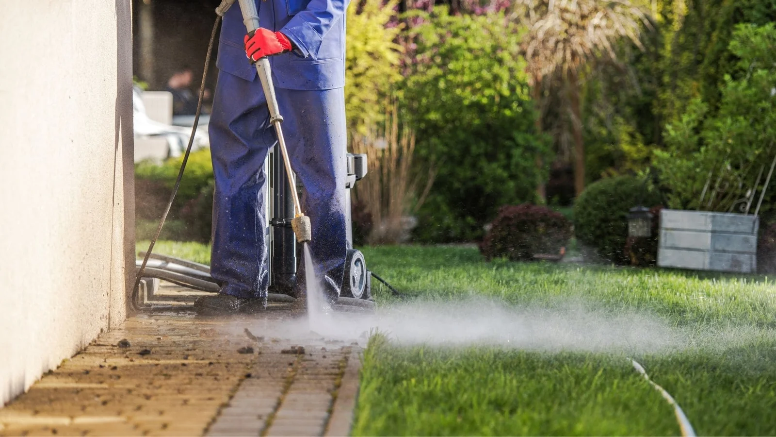 Pressure washing brick pavers and concrete walkway with professional equipment
